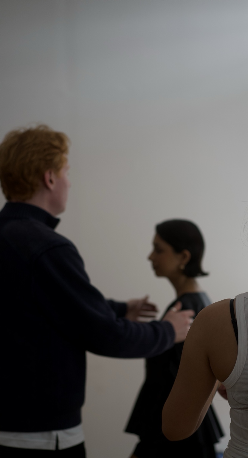 Roman Craig working with a model on set